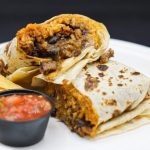 Golden Burrito stuffed with meat, cheese, rice and beans